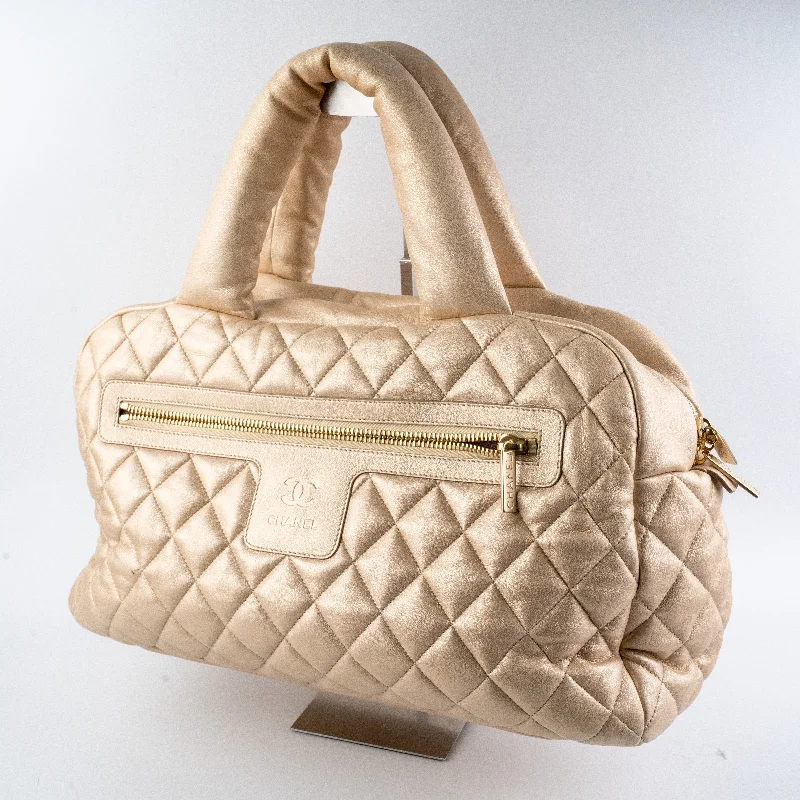 Chanel bags with exclusive seasonal designs and materialsChanel Gold Cacoon Bag