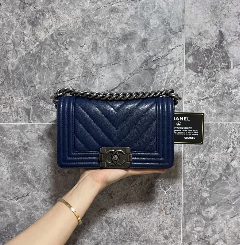 Chanel bags with exclusive seasonal designs and materialsLNIB Caviar Small Boy Navy Blue No 24