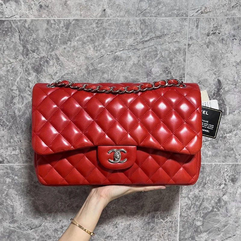 Chanel bags with exclusive seasonal designs and materialsLNIB Jumbo Classic Double Flap Lambskin Red No 15