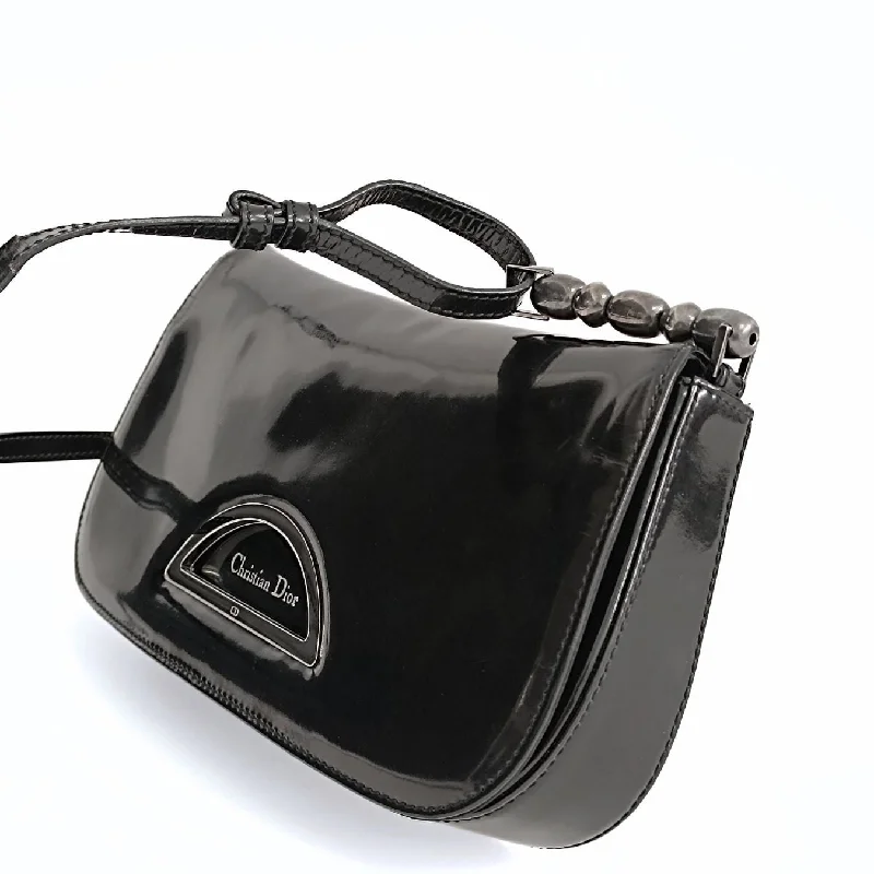 Christian Dior Saddle bags with a patent leather finish for a shiny lookDIOR Christian Maris Pearl shoulder baguette in black patent leather